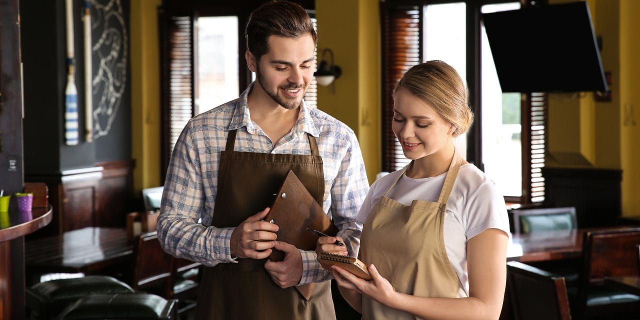 1741810831252 male and female waitstaff restaurant